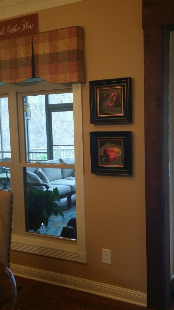 Framed 8x8 bell pepper paintings in Linda's home